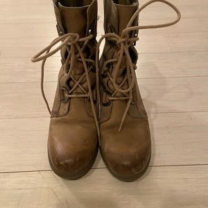 Sorel lace up wedge booties.